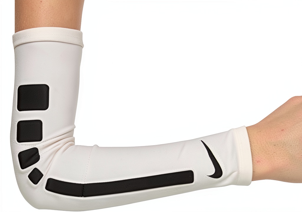 Youth basketball player wearing Nike shooter sleeve on an outdoor court